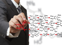 chemist draws a molecular structure